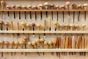 wood carving tools on a tool rack