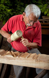 wood-carver using wood carving tools